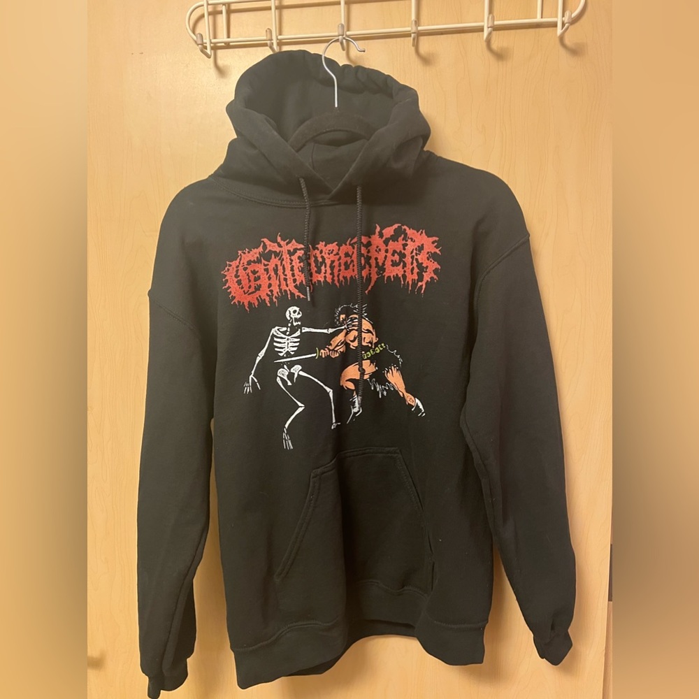 Gatekeeper Pull Over Hoodie, Caveman stabbing skeleton, size S